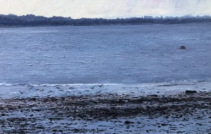 Close up of the painting's rocky foreground, shoreline, and distant water.