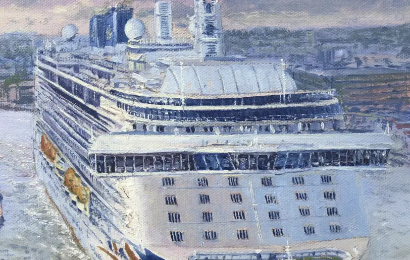 Close up of the cruise ship Britannia's superstructure and port side, with the distant cruise terminal visible.