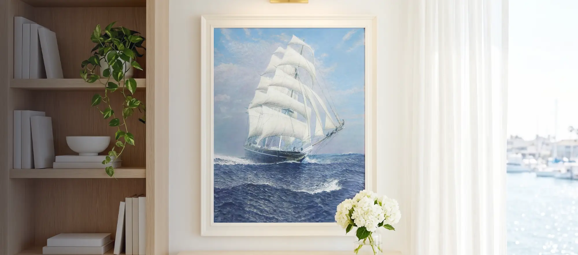 Framed portrait painting of the Cutty Sark hanging in a bright modern room next to a window overlooking a sunny marina.