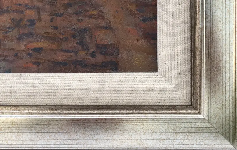 Close up of the champagne gold picture frame, inner white linen slip, and the artist's signature blending into the painted architecture.