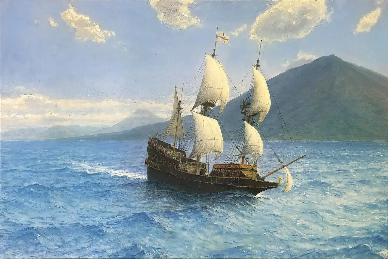 Oil painting of the historic 16th-century galleon Golden Hinde sailing on bright blue, choppy seas. The dark wooden ship, flying a St George's cross, has its white sails billowing as it passes in front of large, hazy green-blue mountainous islands under a bright, partly cloudy sky.