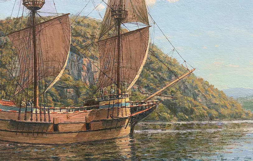 Close-up shot of the main mast, rigging details, and sails set against the surrounding Hudson River hills.