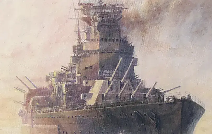 Close up of the massive forward gun turrets and towering bridge structure of HMS King George V.