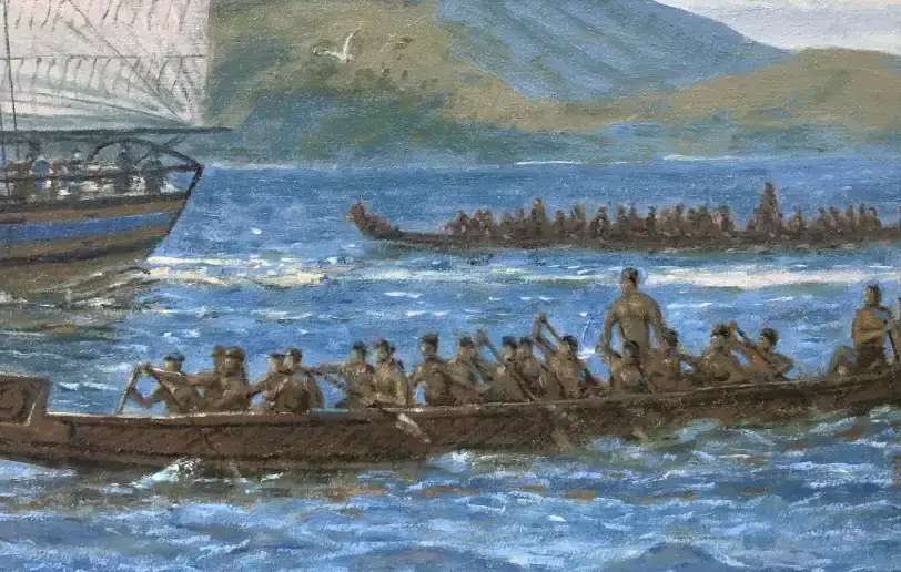 Close up of a large wooden Māori waka (canoe) on the water, filled with numerous figures rowing in unison.