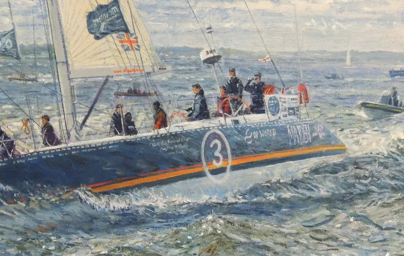 Close up of the center of the hull, showing the number 3 painted on the side and the crew actively sailing the boat.