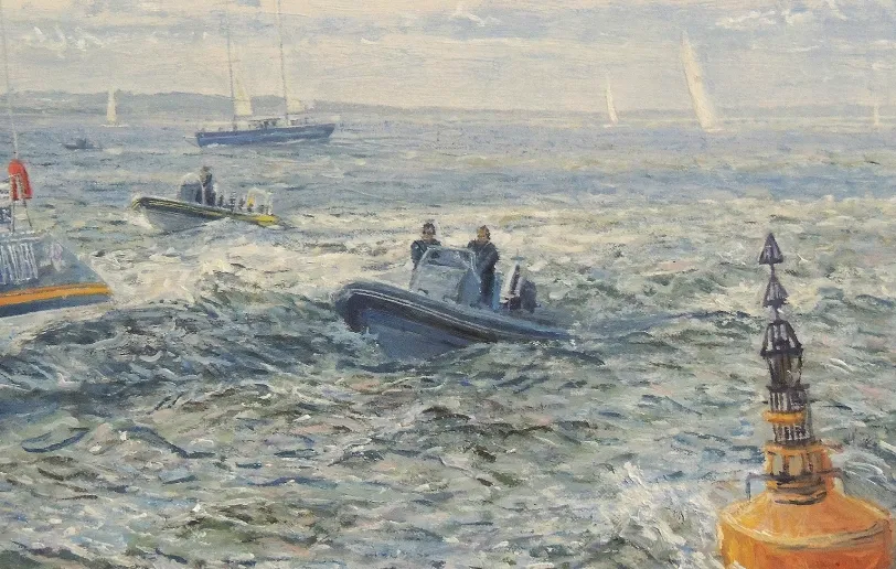 Close up of the water ahead of the yacht, showing a spectator rib boat bouncing in the waves and an orange marker buoy.