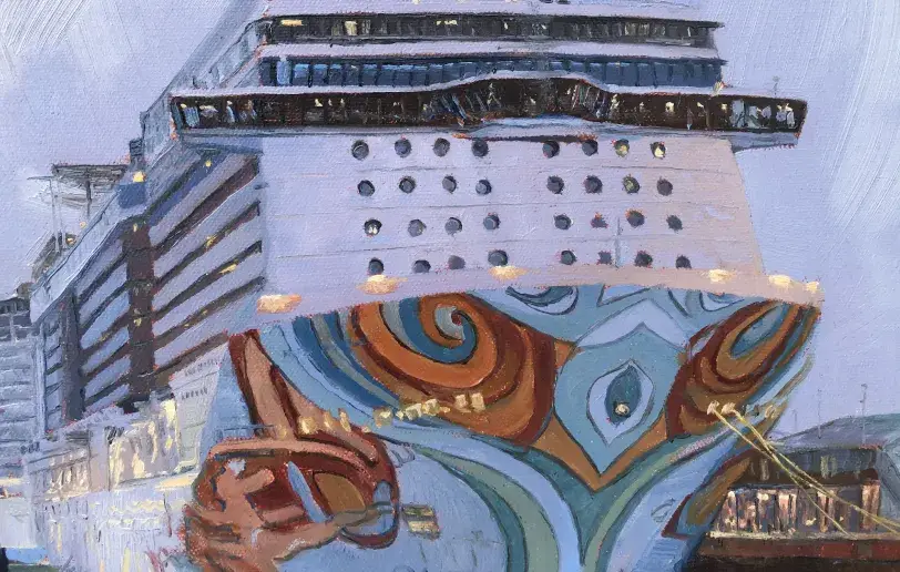 Close up of the elaborate orange and blue swirling decorations painted on the bow of the Norwegian Getaway.