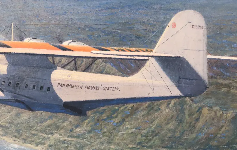 Close up of the flying boat's fuselage and tail, showing the Pan American Airways System lettering and period details.