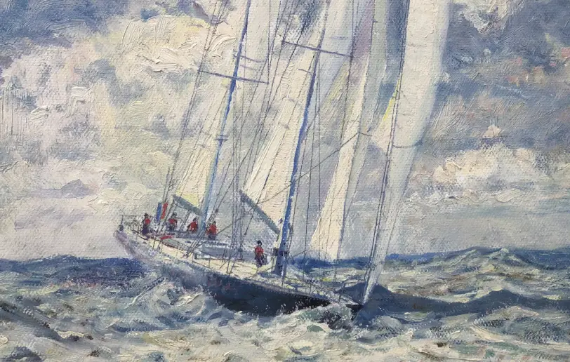Close up of the yacht Pen Duick VI leaning into the wind with full sails, with the crew visible on deck.