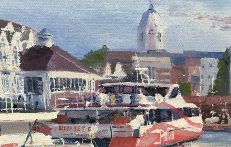 Close up of the right side showing the distinctive red and white Red Funnel ferries docked at the terminal.