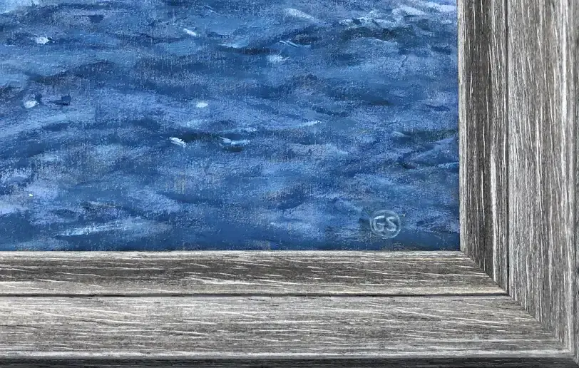 Close up of the distressed silver-grey picture frame and inner white linen slip, alongside the artist's signature.