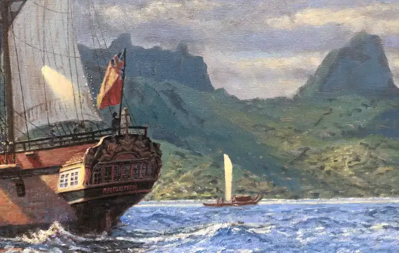 Close up of the right side showing the detailed stern of HMS Resolution flying the Red Ensign, with jagged island peaks in the background.