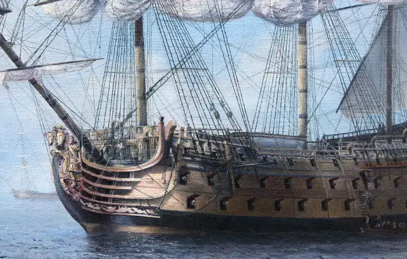 Close up of the elaborately decorated stern and hull of HMS Royal William, showing her carvings and open gun ports.