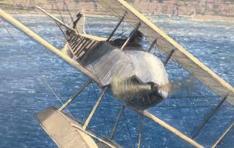 Close up of Howard Pixton's Sopwith Tabloid biplane, showing the wire rigging, floats, and spinning propeller.