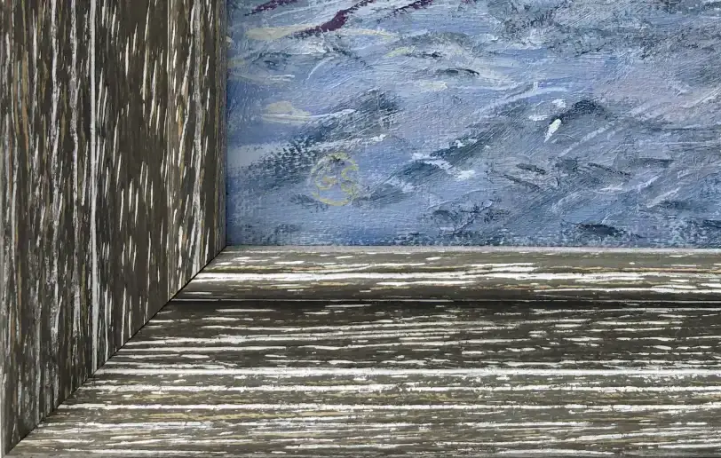 Close up of the distressed charcoal grey picture frame and inner white linen slip, contrasting with the painted blue ocean waves.