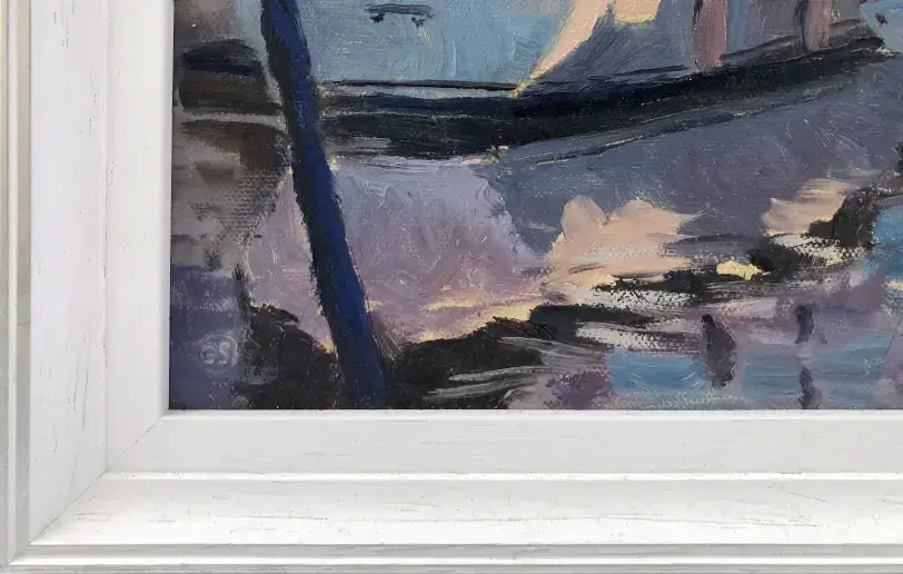 Close up of the white wood picture frame and the artist's signature painted in the bottom corner of the canvas.