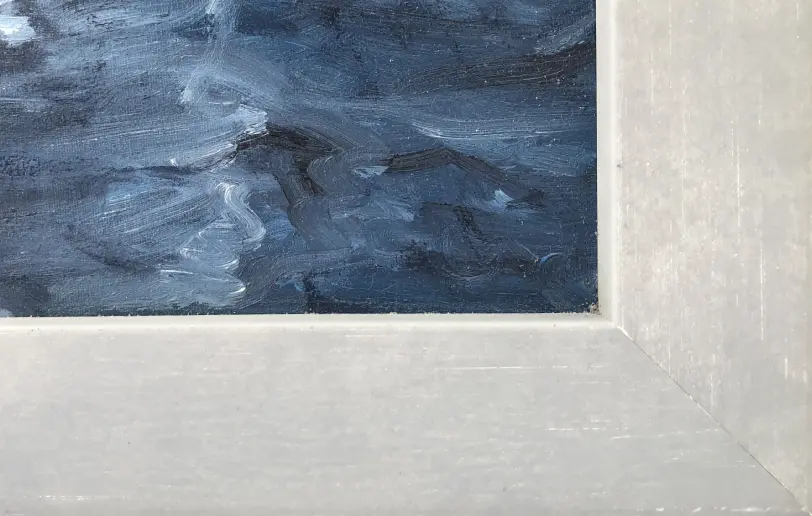 Close up of the pale grey wooden picture frame, showing the textured brushstrokes of the painted dark blue water.