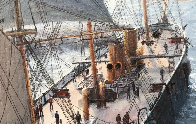 Close up looking down at the deck of HMS Warrior, showing the twin funnels, lifeboats, and the tiny figures of the crew working on deck.